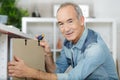 Happy senior carpenter at work Royalty Free Stock Photo