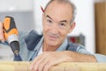Happy senior carpenter at work Royalty Free Stock Photo