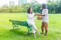 Asian senior couple enjoying picnic in garden. Royalty Free Stock Photo