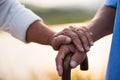 A happy senior couple asian old man and woman hold hand each other and standing in summer near mountain and lake during sunrise or Royalty Free Stock Photo