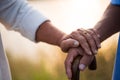 A happy senior couple asian old man and woman hold hand each other and standing in summer near mountain and lake during sunrise or