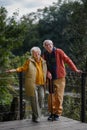 Happy senior couple at autumn walk near the lake, having break. Royalty Free Stock Photo