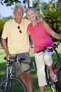 Happy Senior Couple on Bicycles In A Park