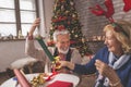 Senior couple wrapping Christmas presents