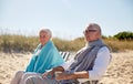 Happy senior couple in chairs on summer beach Royalty Free Stock Photo