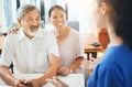 Happy, senior couple and consultation with doctor in office for rehabilitation, results and update on health care. Nurse Royalty Free Stock Photo