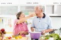 Senior couple cooking in kitchen Royalty Free Stock Photo