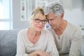 Happy senior couple cuddling at home Royalty Free Stock Photo