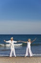Happy Senior Couple Dancing Holding Hands on Beach Royalty Free Stock Photo