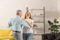 Happy senior couple dancing in room Royalty Free Stock Photo