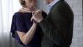 Happy senior couple dancing, looking at each other and smiling, anniversary Royalty Free Stock Photo