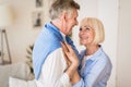 Happy senior couple dancing and smiling to each other Royalty Free Stock Photo