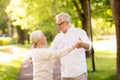 Happy senior couple dancing at summer park Royalty Free Stock Photo