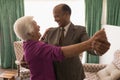 Happy senior couple dancing together at home Royalty Free Stock Photo