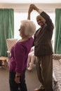 Happy senior couple dancing together at home Royalty Free Stock Photo