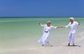 Happy Senior Couple Dancing on Tropical Beach Royalty Free Stock Photo