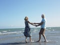 Happy Senior Couple Dancing On Tropical Beach Royalty Free Stock Photo