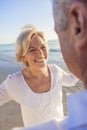 Happy Senior Couple Dancing on A Tropical Beach Royalty Free Stock Photo