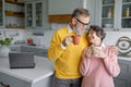 Happy senior couple drinking coffee or tea on home kitchen Royalty Free Stock Photo