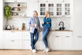 Happy Senior Couple Drinking Morning Coffee And Chatting In Kitchen At Home Royalty Free Stock Photo