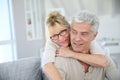 Happy senior couple embracing at home Royalty Free Stock Photo