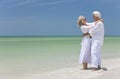 Happy Senior Couple Embracing on A Tropical Beach Royalty Free Stock Photo