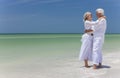 Happy Senior Couple Embracing on Tropical Beach Royalty Free Stock Photo