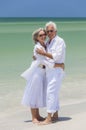 Happy Senior Couple Embracing on Tropical Beach Royalty Free Stock Photo