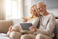 Happy Senior Couple Enjoying Digital Gadget World Using Their Tablet Royalty Free Stock Photo