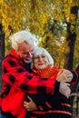 Happy senior couple enjoying each other in the park. Support and care from a loved one, warm emotions Royalty Free Stock Photo