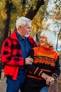 Happy senior couple enjoying each other in the park. Support and care from a loved one, warm emotions Royalty Free Stock Photo