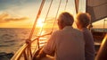 senior couple enjoying sunset from sailing boat Royalty Free Stock Photo