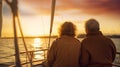 senior couple enjoying sunset from sailing boat Royalty Free Stock Photo