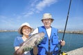 Happy senior couple go fishing Royalty Free Stock Photo