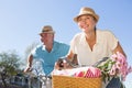 Happy senior couple going for a bike ride in the city Royalty Free Stock Photo