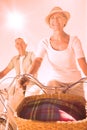 Happy senior couple going for a bike ride Royalty Free Stock Photo