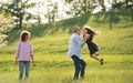 Senior couple with granddaughter outside in spring nature, having fun. Royalty Free Stock Photo