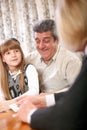 Happy senior couple with granddaughter playing cards Royalty Free Stock Photo