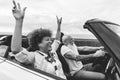 Happy senior couple having fun in convertible car during summer vacation - Focus on mature woman face Royalty Free Stock Photo