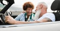 Happy senior couple having fun in convertible car during summer vacation - Focus on woman face Royalty Free Stock Photo