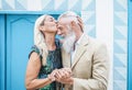 Happy senior couple having tender moments outdoor - Mature elegant people celebrating date of their anniversary Royalty Free Stock Photo