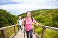 Happy senior couple hiking on the mountain park