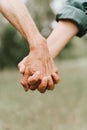 Happy senior couple holding hands. hands of man and woman hold each other. romance and love and support in elderly family. faceles Royalty Free Stock Photo