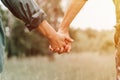 happy senior couple holding hands. hands of man and woman hold each other. romance and love and support in elderly family. faceles Royalty Free Stock Photo