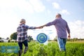 Happy senior couple holding hands at summer farm Royalty Free Stock Photo