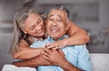 Happy senior couple, hug and care in love for relationship bonding together relaxing at home. Joyful elderly man and Royalty Free Stock Photo