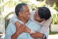 Happy senior couple hug in garden, love and romance in retirement. Nature, summer and mature man and woman hugging Royalty Free Stock Photo