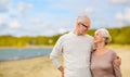 Happy senior couple hugging over beach background Royalty Free Stock Photo