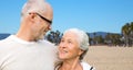 Happy senior couple hugging over venice beach Royalty Free Stock Photo