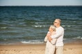 Happy senior couple hugging on summer beach Royalty Free Stock Photo